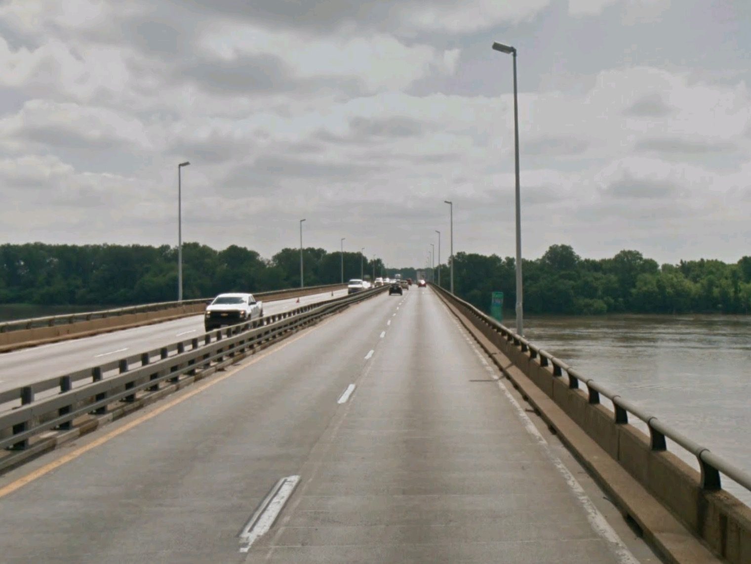 Driving across the Chain of Rocks Bridge on I-270, a straight concrete deck over the Mississippi River with trees on the far bank